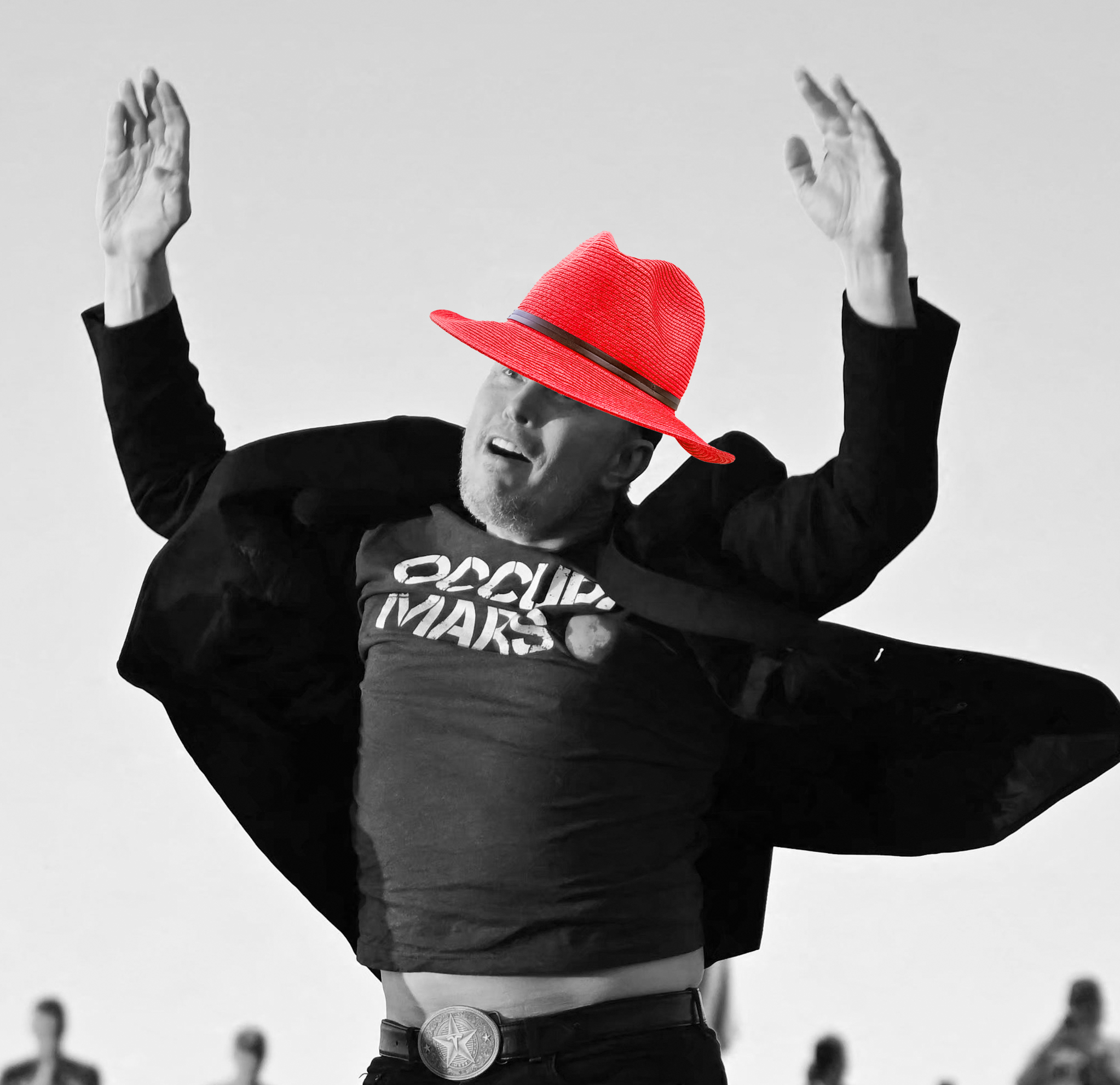 A black and white photo of Elon jumping in the air with his arms up and his stomach hanging out over unbuttoned jeans. A bright red fedora has been added to his head.